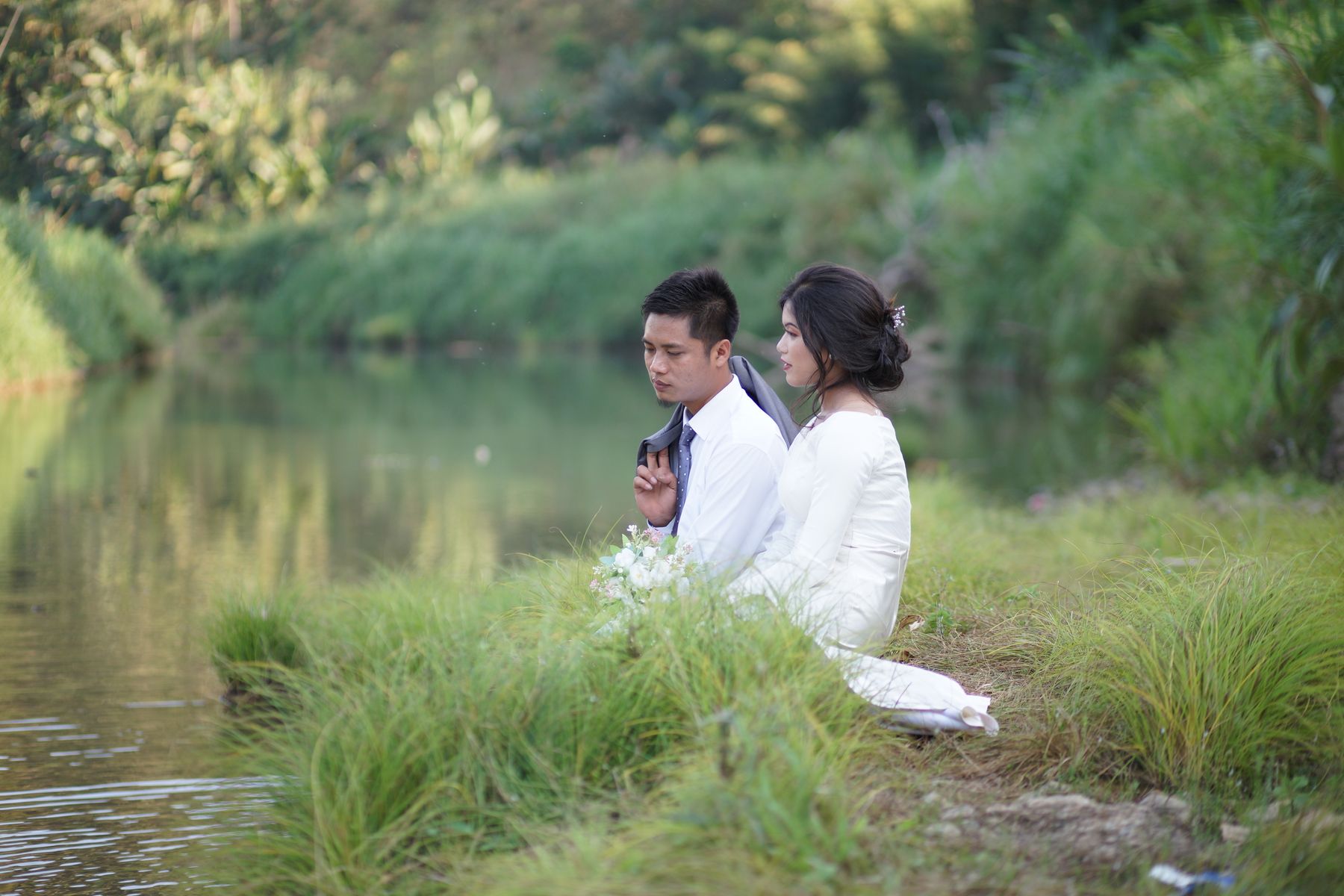 Couple at the river's edge